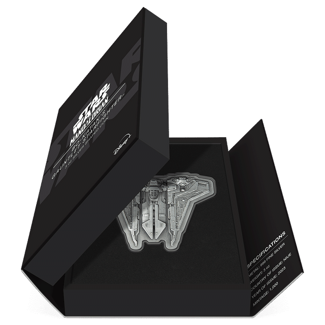 The Mandalorian™ – Bo-Katan's Gauntlet Starfighter™ 3oz Silver Shaped Coin Featuring Book-style Packaging with Coin Insert and Certificate of Authenticity Sticker and Coin Specs.