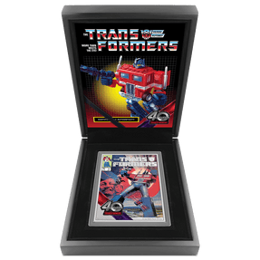 Transformers 40 Years – 5oz Silver Poster Coin Featuring Book-style Packaging with Coin Insert and Certificate of Authenticity Sticker and Coin Specs. 