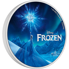 Let the icy magic of Disney’s Frozen come alive in the palm of your hands! Features a beautiful, coloured image of Disney’s Elsa unleashing her powers. The film title and Disney logo are frosted, and a blue stone adds a special touch to the design. - New Zealand Mint