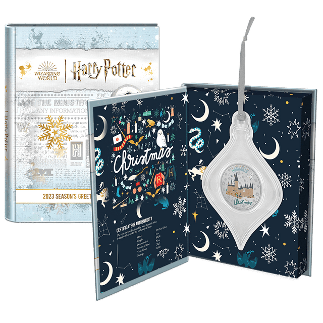 HARRY POTTER™ Season’s Greetings 2023 1oz Silver Coin Featuring Custom Book-style Display Box With Brand Imagery and Ribbon for Tree-Hanging. 
