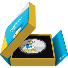 Disney Mickey & Friends – Donald Duck 1oz Silver Coin Featuring Book-style Packaging with Coin Insert and Certificate of Authenticity Sticker and Coin Specs.
