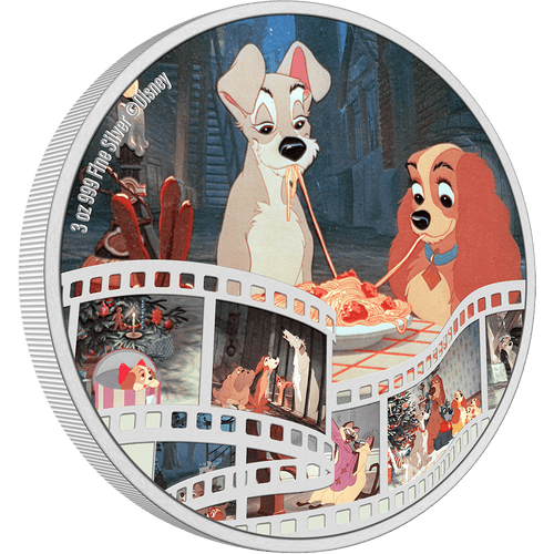 The coin shows a beloved scene, in full colour, where the two dogs are on a romantic evening and share a plate of spaghetti. Along the bottom is a film scroll, showcasing a lovely montage of all your favourite characters from the movie. - New Zealand Mint
