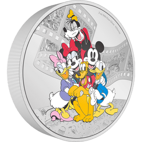 This 3oz pure silver coin features a coloured image of Disney’s Mickey & Friends, in a warm embrace. Behind them is a frosted film scroll showing some of the crew’s fun adventures and some charming motifs have been engraved along the bottom. - New Zealand Mint
